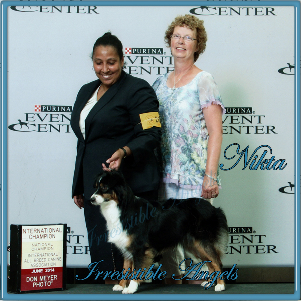 Nikita winning her International title.